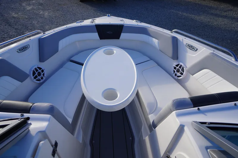Slide: The Image of 2024 Chaparral 23 SSi OB boat interior with seating and table. - 8