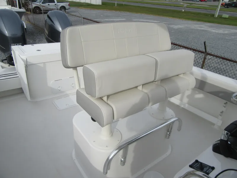 Slide: The Image of 2023 Parker 2501 Center Console boat with cushioned seating and dual outboard motors. - 14