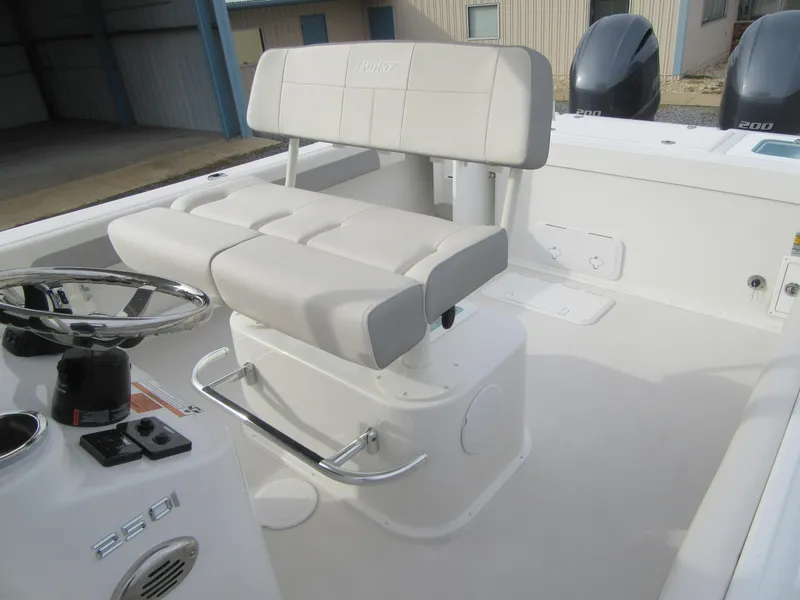 Slide: The Image of 2023 Parker 2501 Center Console boat interior with cushioned seating and dual outboard motors. - 15