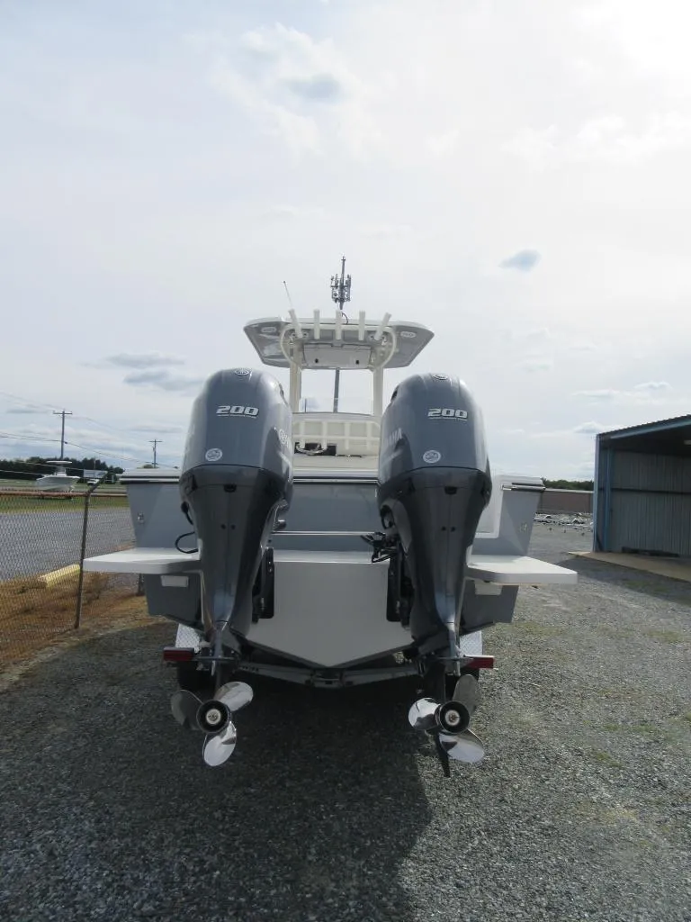 Slide: The Image of 2023 Parker 2501 Center Console boat with twin 200 horsepower engines. - 4