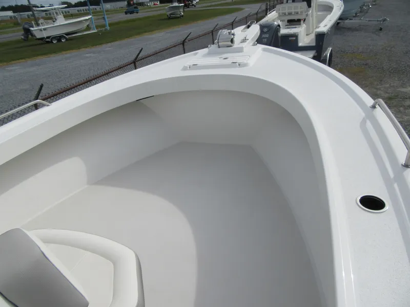 Slide: The Image of 2023 Parker 2501 Center Console boat, spacious bow area, white interior. - 6
