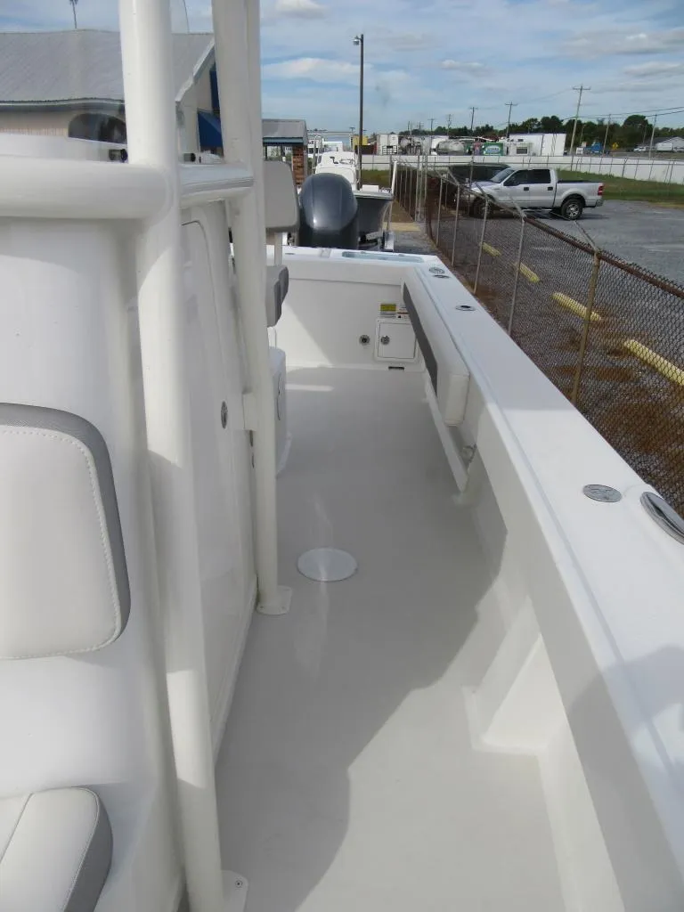 Slide: The Image of 2023 Parker 2501 Center Console boat deck with seating and storage. - 8