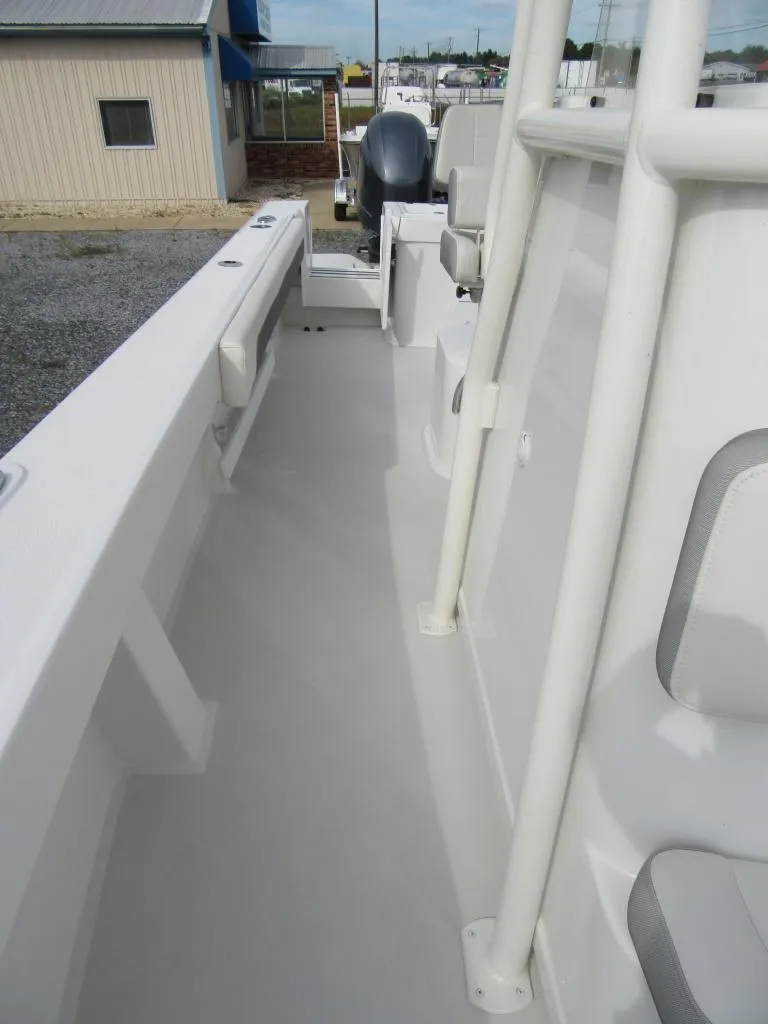 Slide: The Image of 2023 Parker 2501 Center Console boat deck with seating and storage compartments. - 9
