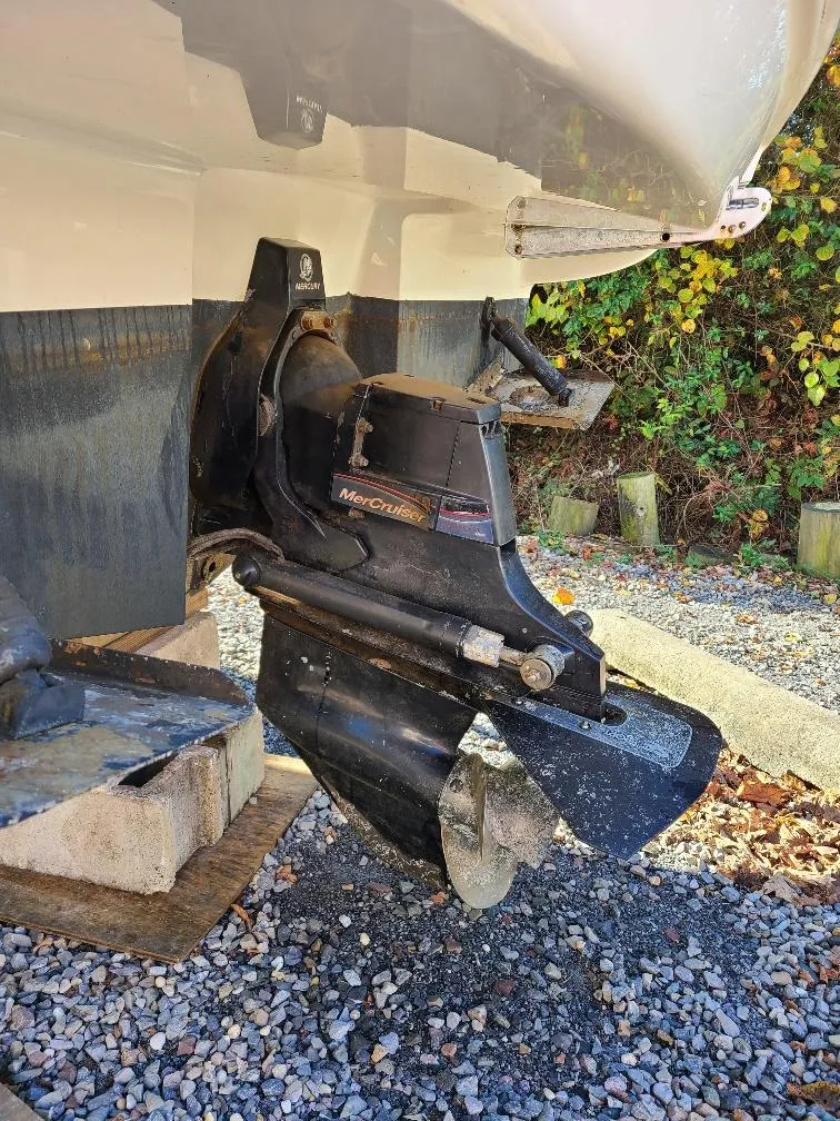 Slide: The Image of 2010 Sea Ray 240 Sundancer boat with MerCruiser outdrive on gravel. - 8