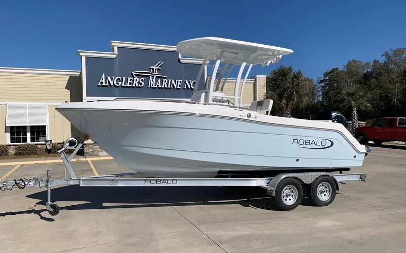 The Image of 2026 Robalo R222 Center Console boat on trailer at Anglers Marine dealership. - 0