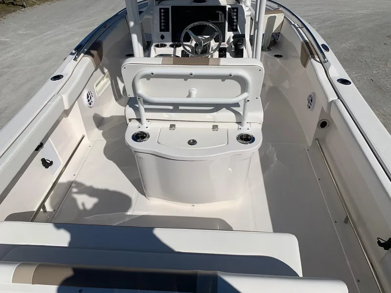 Slide: The Image of 2024 Robalo R222 Center Console boat interior with seating and steering console. - 6