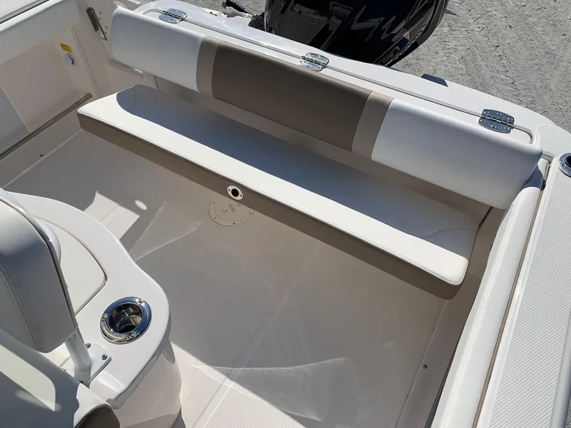 Slide: The Image of 2024 Robalo R222 Center Console boat interior with cushioned seating. - 8
