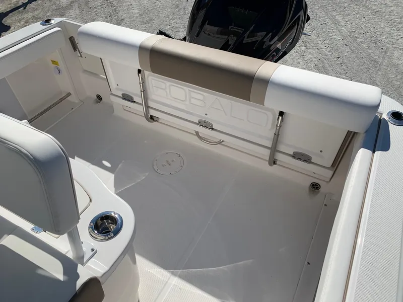 Slide: The Image of 2024 Robalo R222 Center Console boat interior, featuring spacious seating and modern design. - 9