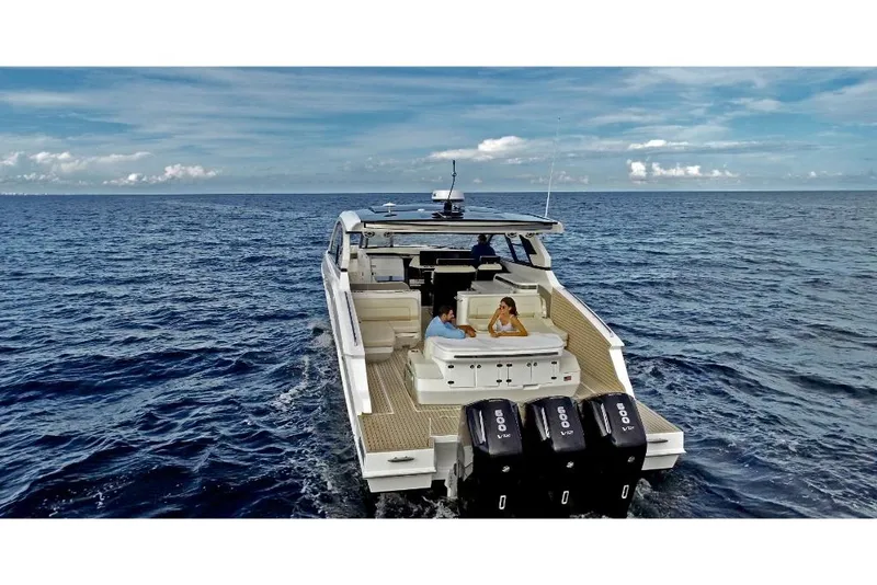 Slide: The Image of 2023 Cruisers Yachts 50 GLS on open water, rear view. - 3