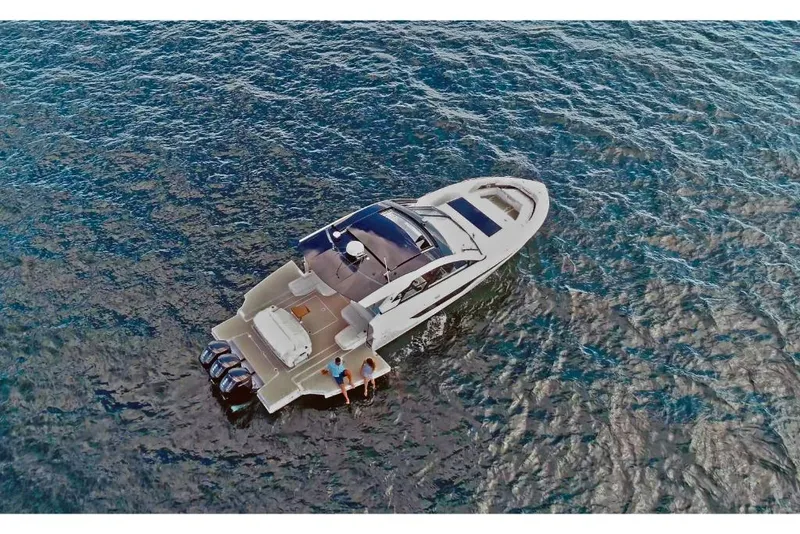 Slide: The Image of 2023 Cruisers Yachts 50 GLS on open water, aerial view. - 4