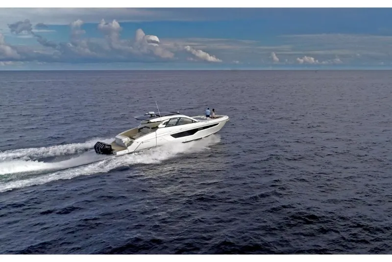 Slide: The Image of 2023 Cruisers Yachts 50 GLS cruising on open water. - 8