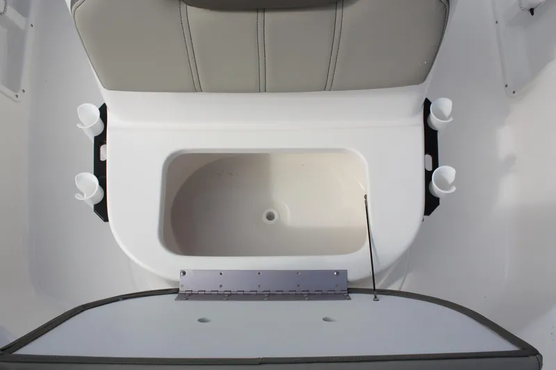 Slide: The Image of 2023 Key West 1720 Center Console boat interior with storage compartment and rod holders. - 18