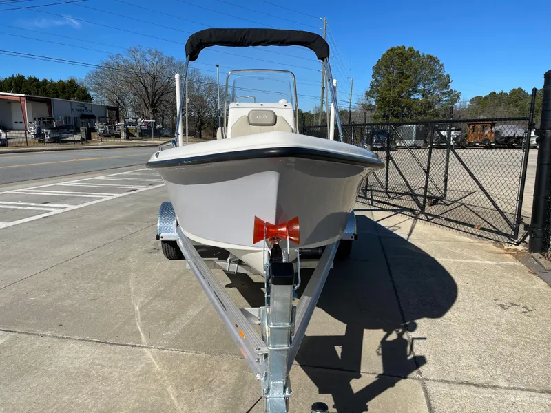 Slide: The Image of 2023 Key West 1720 Center Console boat on trailer, parked outdoors. - 3