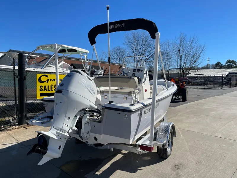 Slide: The Image of 2023 Key West 1720 Center Console boat on trailer, outdoor dealership setting. - 4