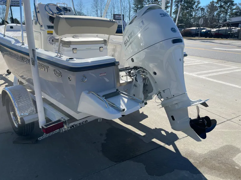 Slide: The Image of 2023 Key West 1720 Center Console boat with Suzuki outboard motor on trailer. - 6