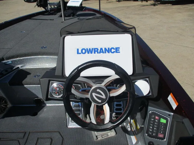 Slide: The Image of 2018 Ranger Z521L ICON boat dashboard with Lowrance electronics and steering wheel. - 9