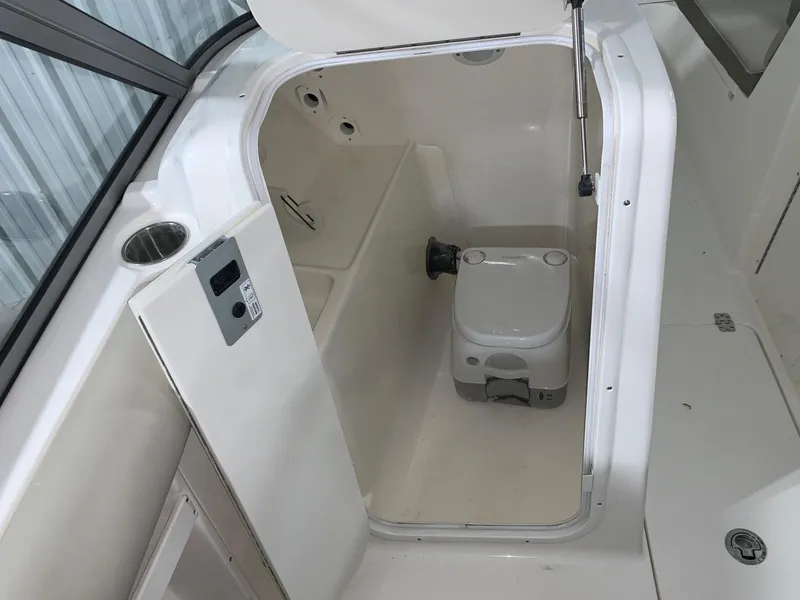 Slide: The Image of 2024 Key West 239 DFS boat interior with compact toilet. - 10