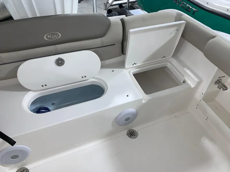 Slide: The Image of 2024 Key West 239 DFS boat interior with storage compartments and speakers. - 14