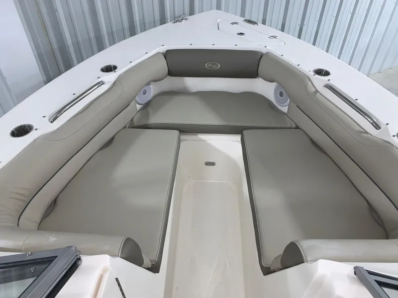 Slide: The Image of 2024 Key West 239 DFS boat interior with cushioned seating. - 3