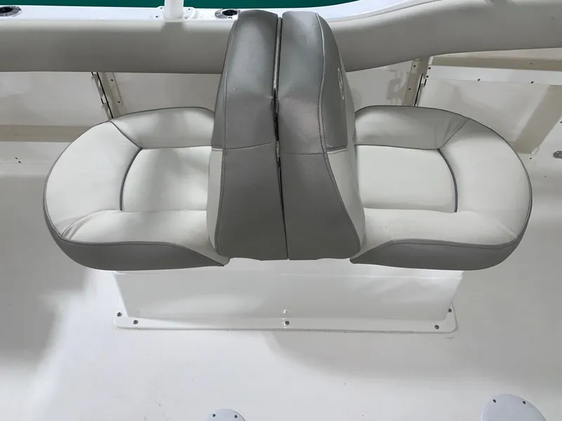 Slide: The Image of 2024 Key West 239 DFS dual boat seats in white and gray upholstery. - 12