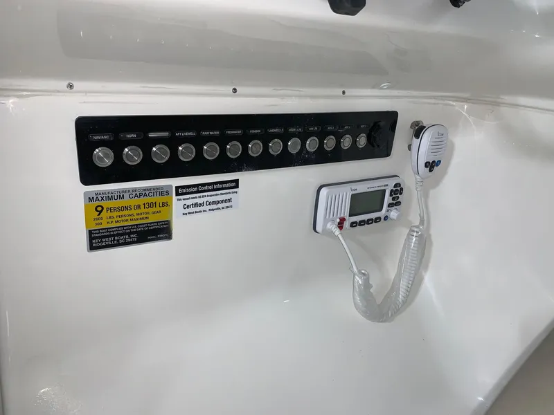 Slide: The Image of Control panel of 2024 Key West 239 DFS boat with capacity and communication equipment. - 9