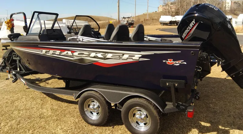 Slide: The Image of 2023 Tracker Targa V-18 WT fishing boat with Mercury outboard engine on trailer. - 2