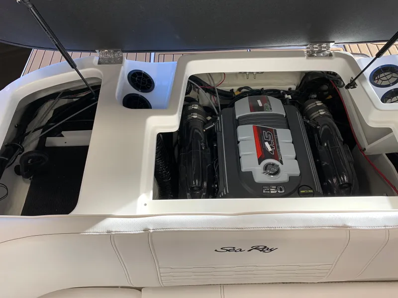 Slide: The Image of 2023 Sea Ray SPX 190 boat engine compartment with open hatch. - 9
