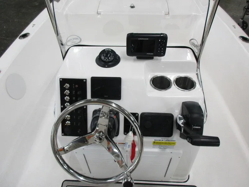 Slide: The Image of 2023 Sea Pro 172 Bay Series boat console with steering wheel, controls, and electronics. - 4
