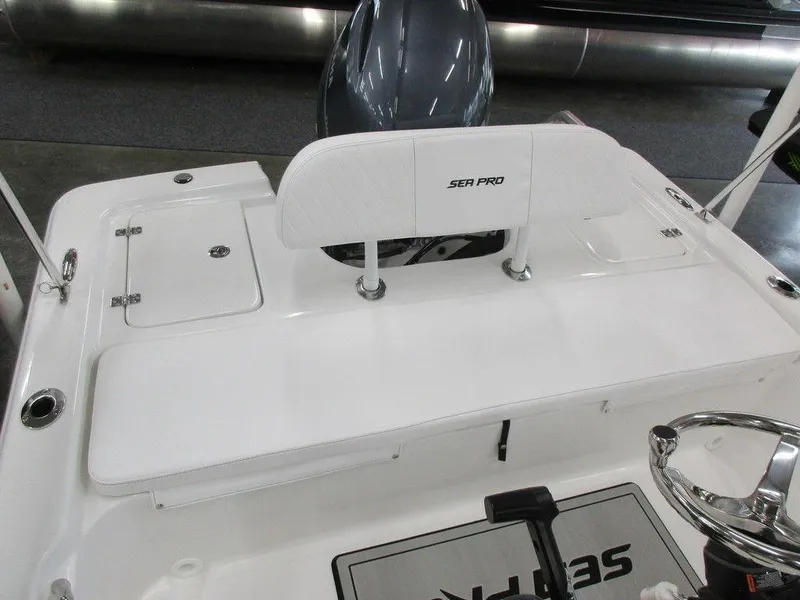 Slide: The Image of 2023 Sea Pro 172 Bay Series boat interior with seating and steering wheel. - 6