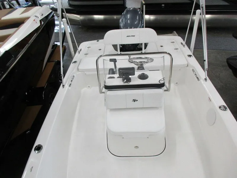 Slide: The Image of 2023 Sea Pro 172 Bay Series boat interior with console and seating. - 7