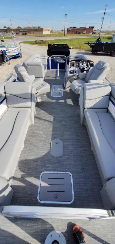 Slide: The Image of 2023 Bennington 22SVSR pontoon boat with spacious seating and modern design. - 3