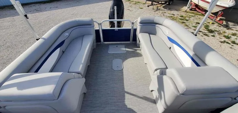Slide: The Image of 2023 Bennington 22SVSR pontoon boat interior with gray seating and spacious layout. - 9