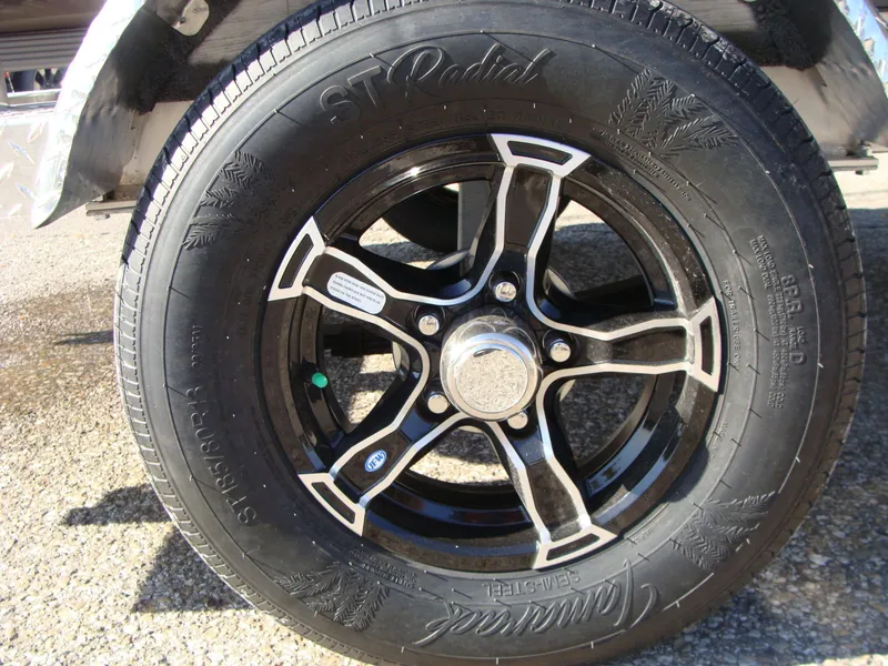 Slide: The Image of Close-up of a 2023 Excel 1754 Pro F4 boat trailer tire and wheel. - 12