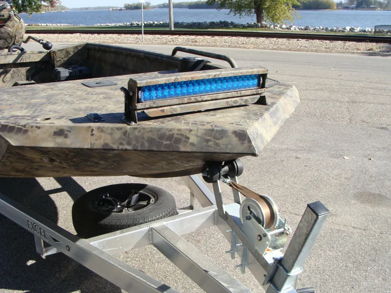 Slide: The Image of 2023 Excel 1754 Pro F4 boat on trailer with blue LED light bar. - 3