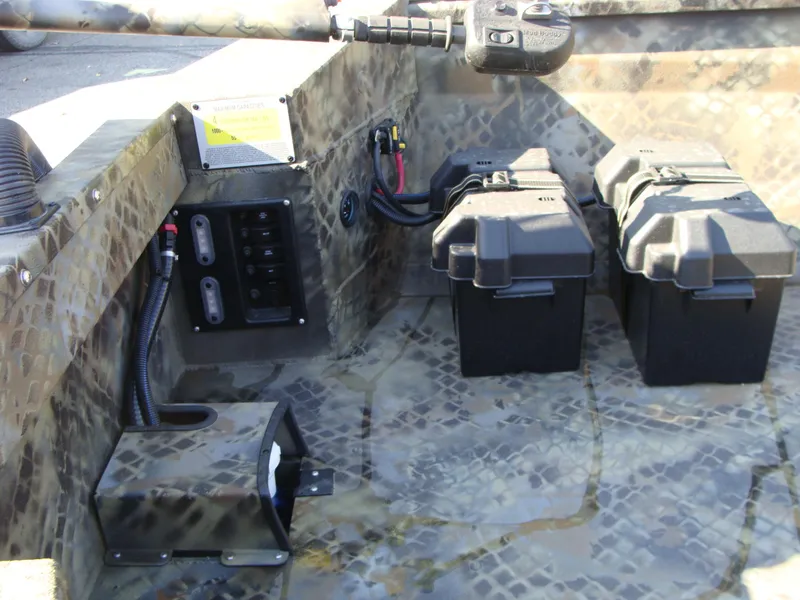 Slide: The Image of 2023 Excel 1754 Pro F4 boat interior with battery compartments and control panel. - 6