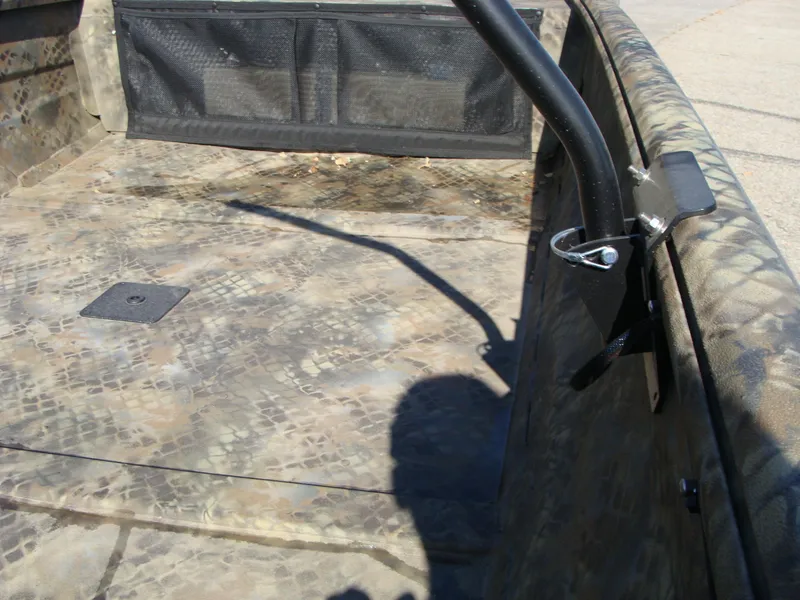 Slide: The Image of 2023 Excel 1754 Pro F4 boat interior with camouflage pattern and storage compartment. - 7