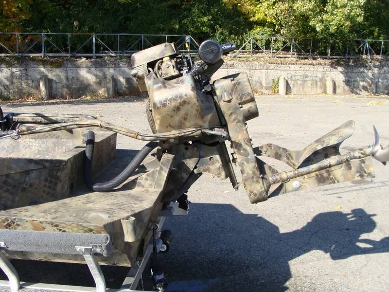 Slide: The Image of 2023 Excel 1754 Pro F4 boat with camo-patterned outboard motor. - 9