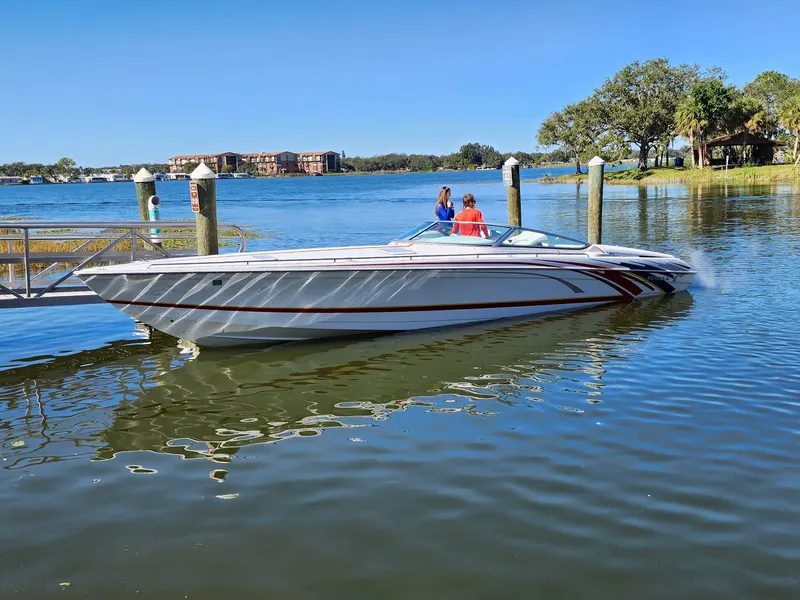 Slide: The Image of 2007 Formula 353 FASTech speedboat docked on a sunny day. - 0