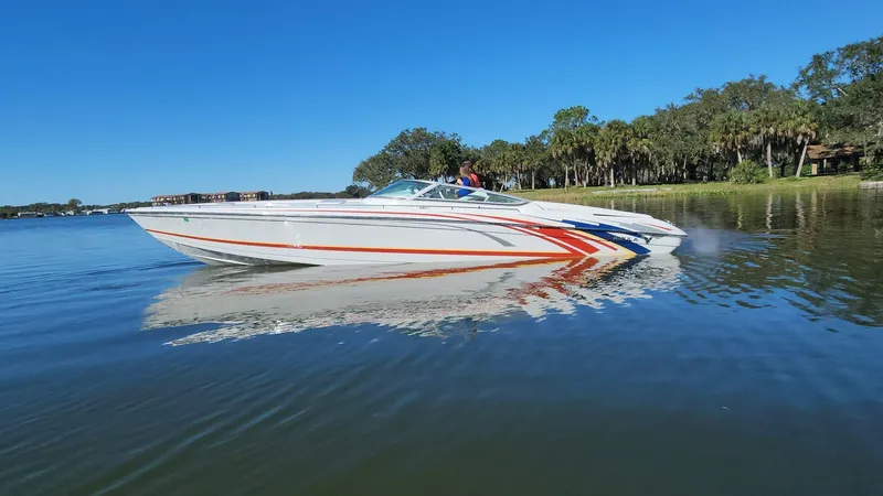Slide: The Image of 2007 Formula 353 FASTech speedboat on calm water with scenic background. - 1