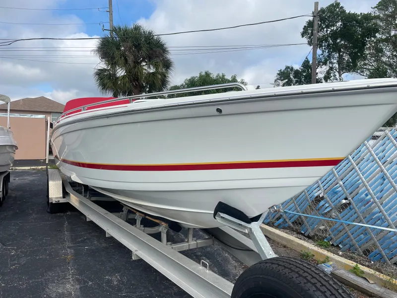 Slide: The Image of 2007 Formula 353 FASTech boat on trailer, white with red and yellow accents. - 12