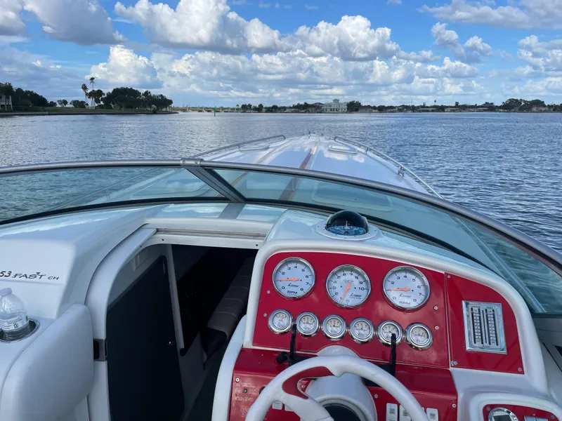 Slide: The Image of 2007 Formula 353 FASTech boat dashboard with water view and cloudy sky. - 22