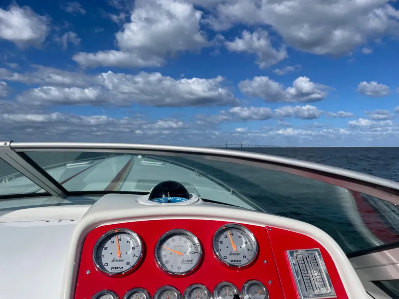 Slide: The Image of 2007 Formula 353 FASTech boat dashboard with ocean view and cloudy sky. - 23