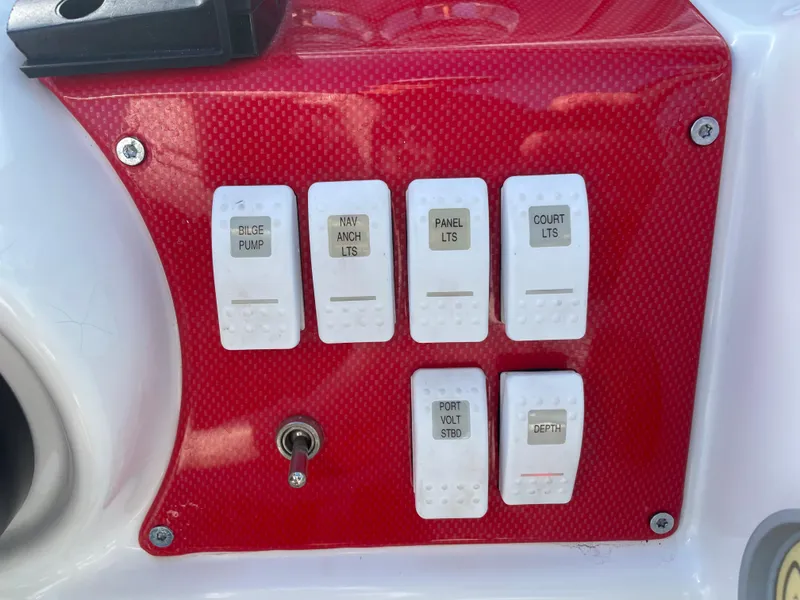 Slide: The Image of Control panel of a 2007 Formula 353 FASTech boat with labeled switches. - 27