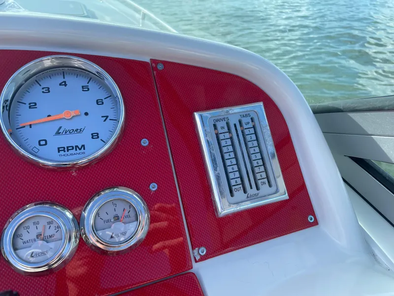 Slide: The Image of 2007 Formula 353 FASTech boat dashboard with Livorsi gauges and controls. - 28