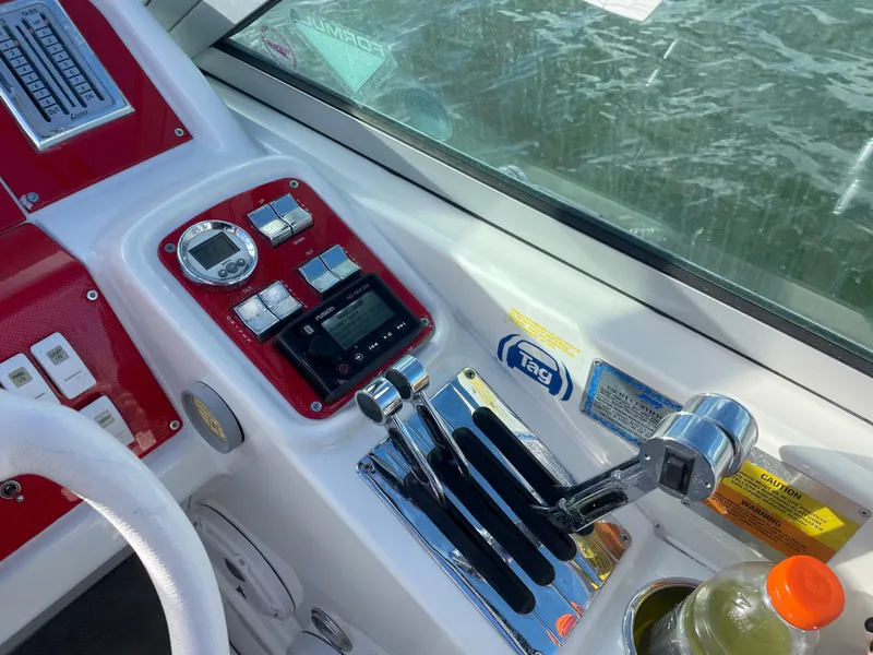 Slide: The Image of 2007 Formula 353 FASTech boat dashboard with controls and gauges. - 29