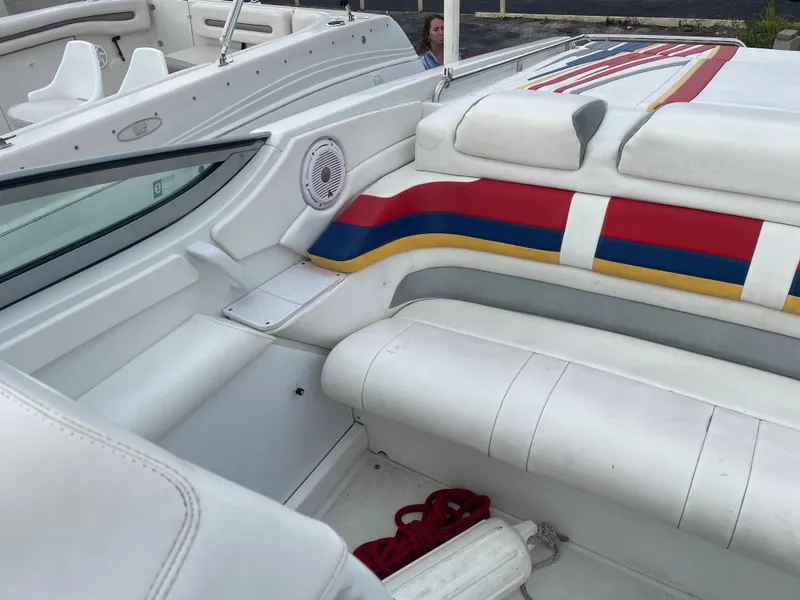 Slide: The Image of 2007 Formula 353 FASTech boat interior with white seating and colorful accents. - 36