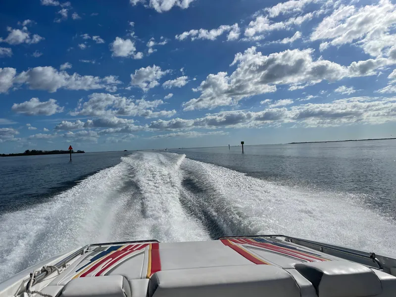 Slide: The Image of 2007 Formula 353 FASTech speedboat cruising on a sunny day with a wake trail. - 4