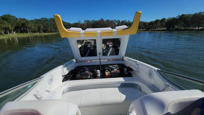 Slide: The Image of 2007 Formula 353 FASTech boat with open engine compartment on a lake. - 6