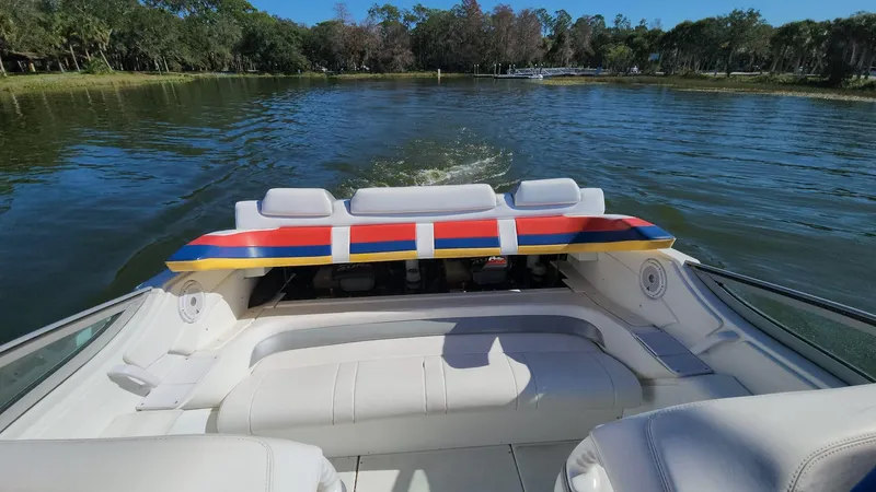 Slide: The Image of 2007 Formula 353 FASTech boat cruising on a serene lake. - 8