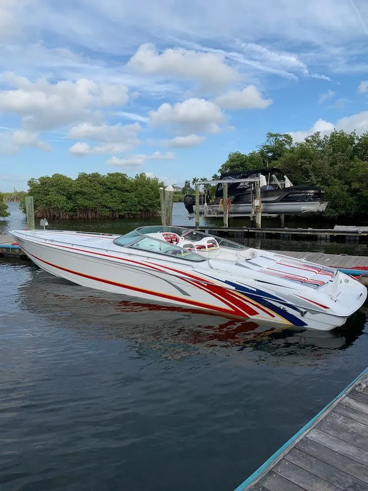 Slide: The Image of 2007 Formula 353 FASTech speedboat docked in a marina. - 9